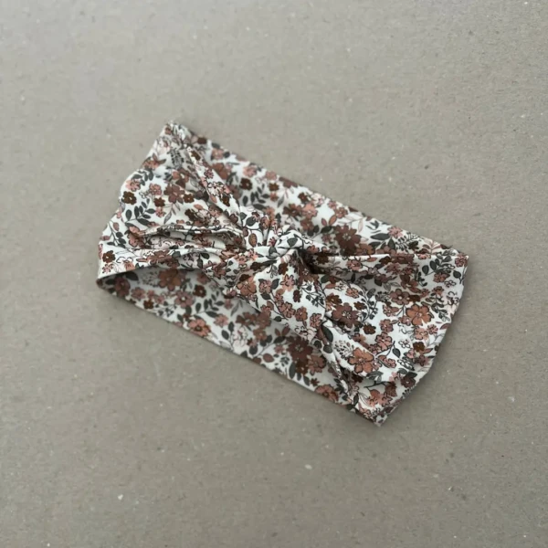 Plati galvos juosta mergaitei su karamelinės pievos gėlių raštu