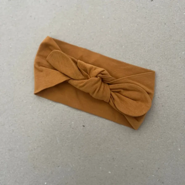 Plati galvos juosta mergaitei sodrios garstyčių spalvos su bantuku