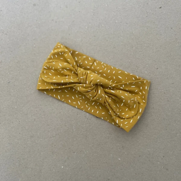 Plati galvos juosta mergaitei garstyčių spalvos su baltais brūkšniukais