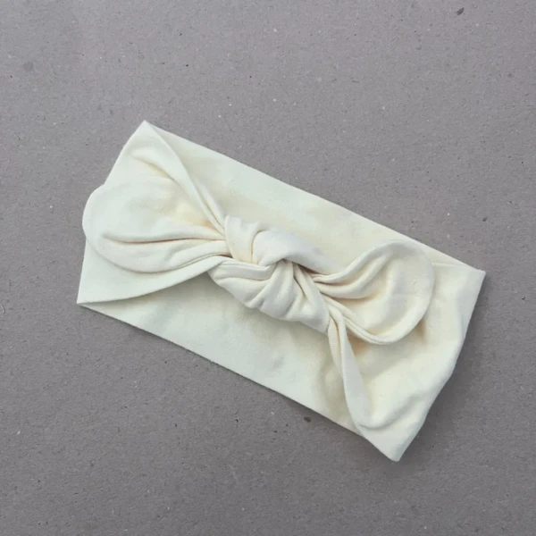 Plati galvos juosta mergaitei šviesiai geltona su bantuku