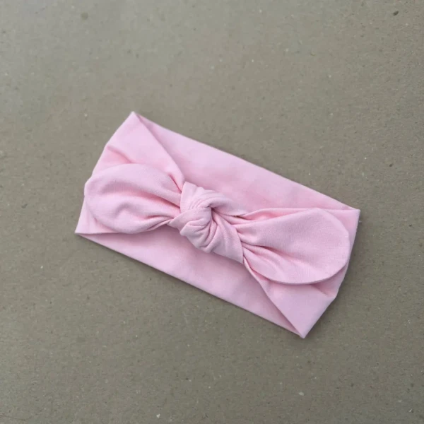 Rožinė plati galvos juosta mergaitei su bantuku